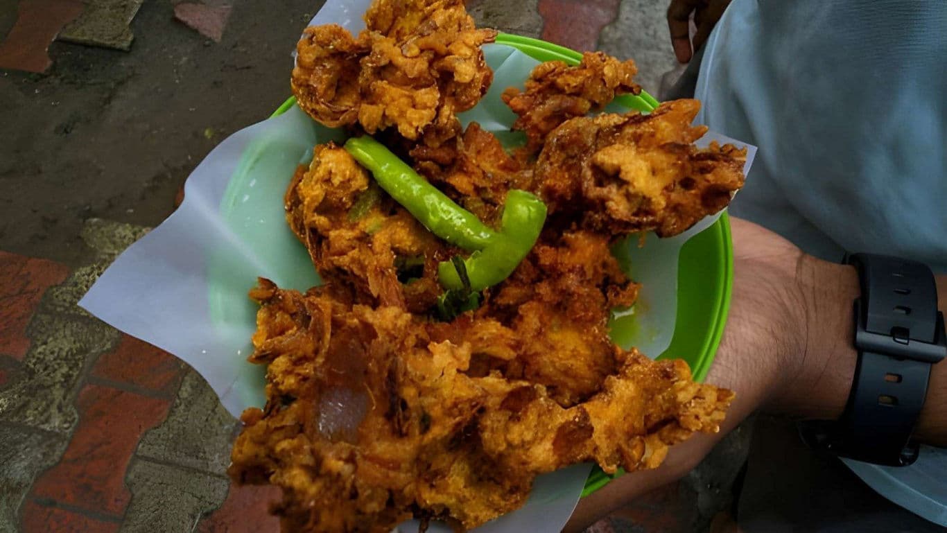 Street food plate with fried snacks and chili