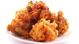Onion bhaji towers on a plate - banner image