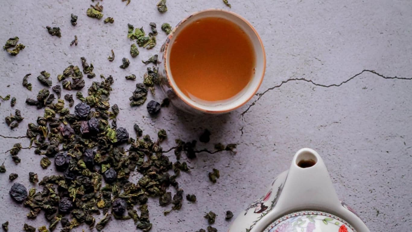 Cup of herbal tea with loose leaves