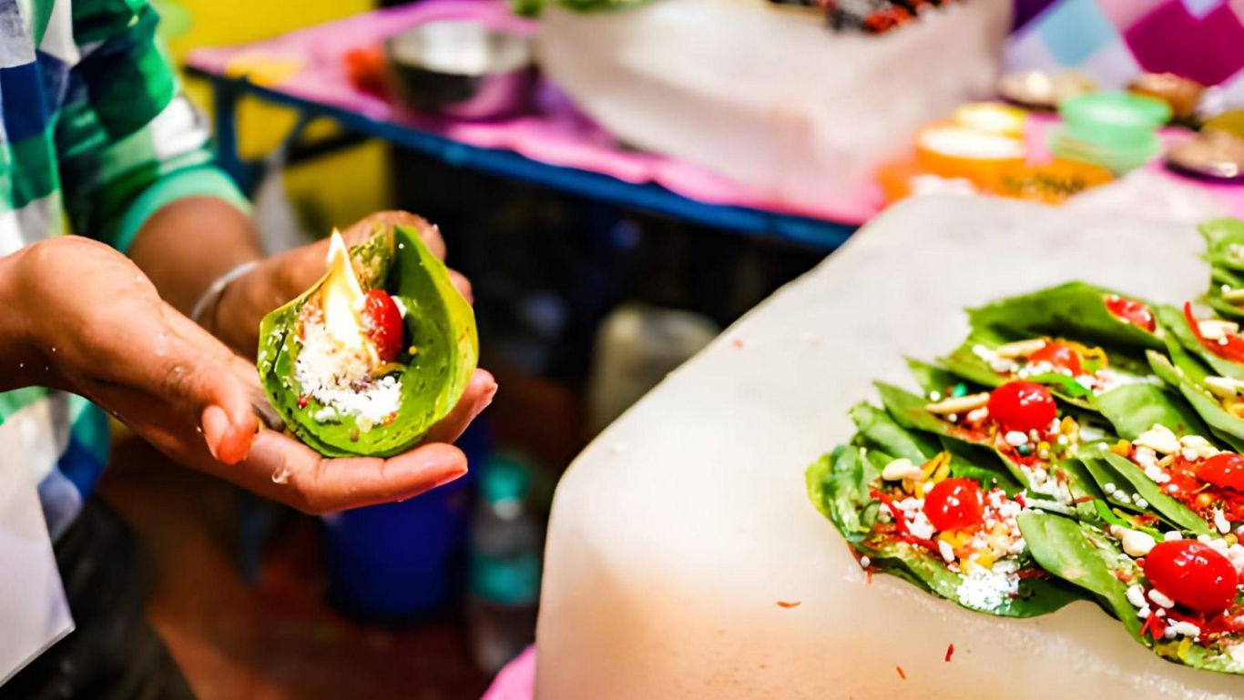 Street vendor preparing colorful betel leaf snack