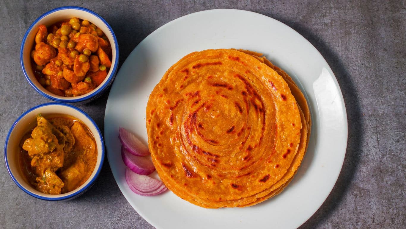 Indian paratha with curry side dishes