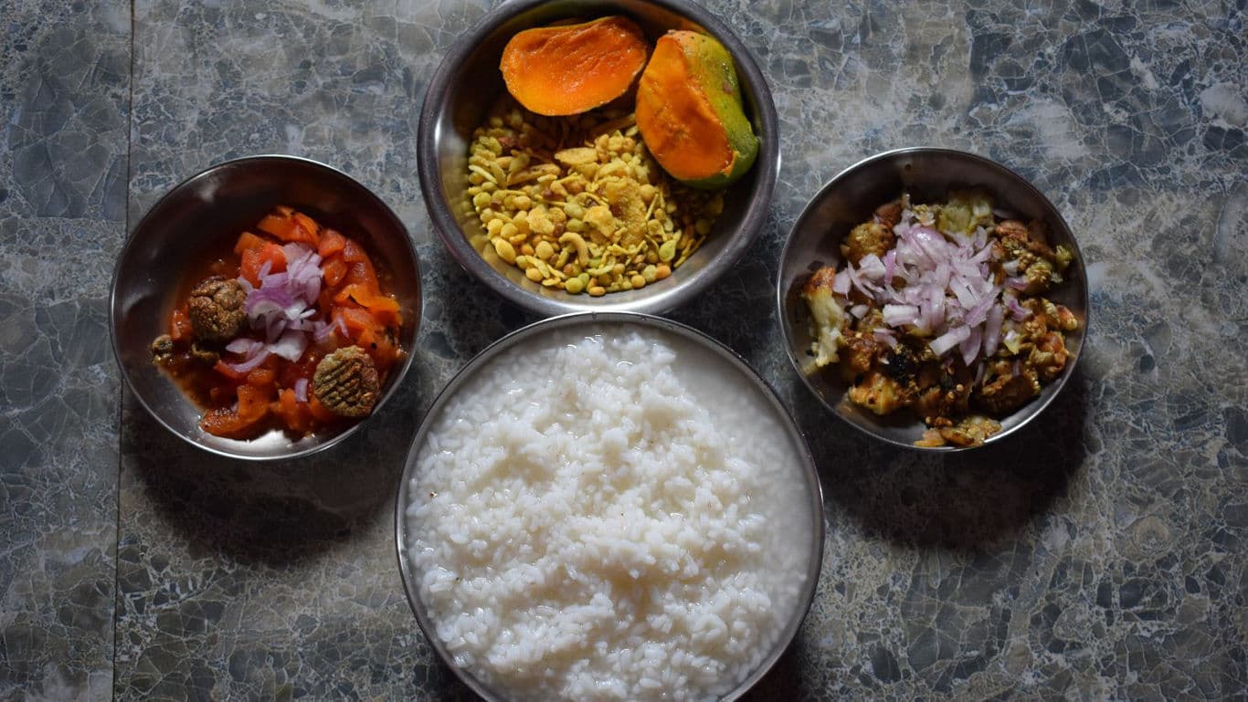 Traditional Indian meal with rice and sides