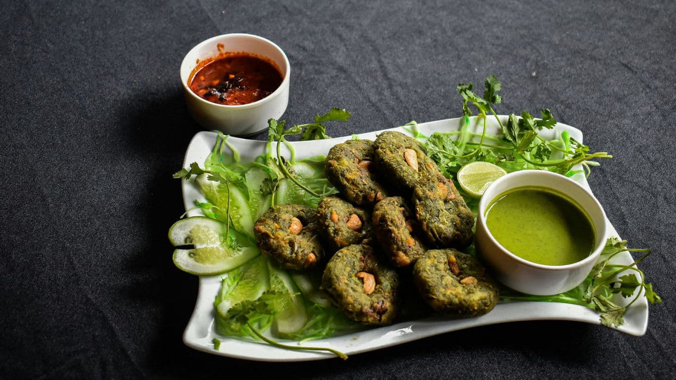 Herb-coated fritters with chutney dips