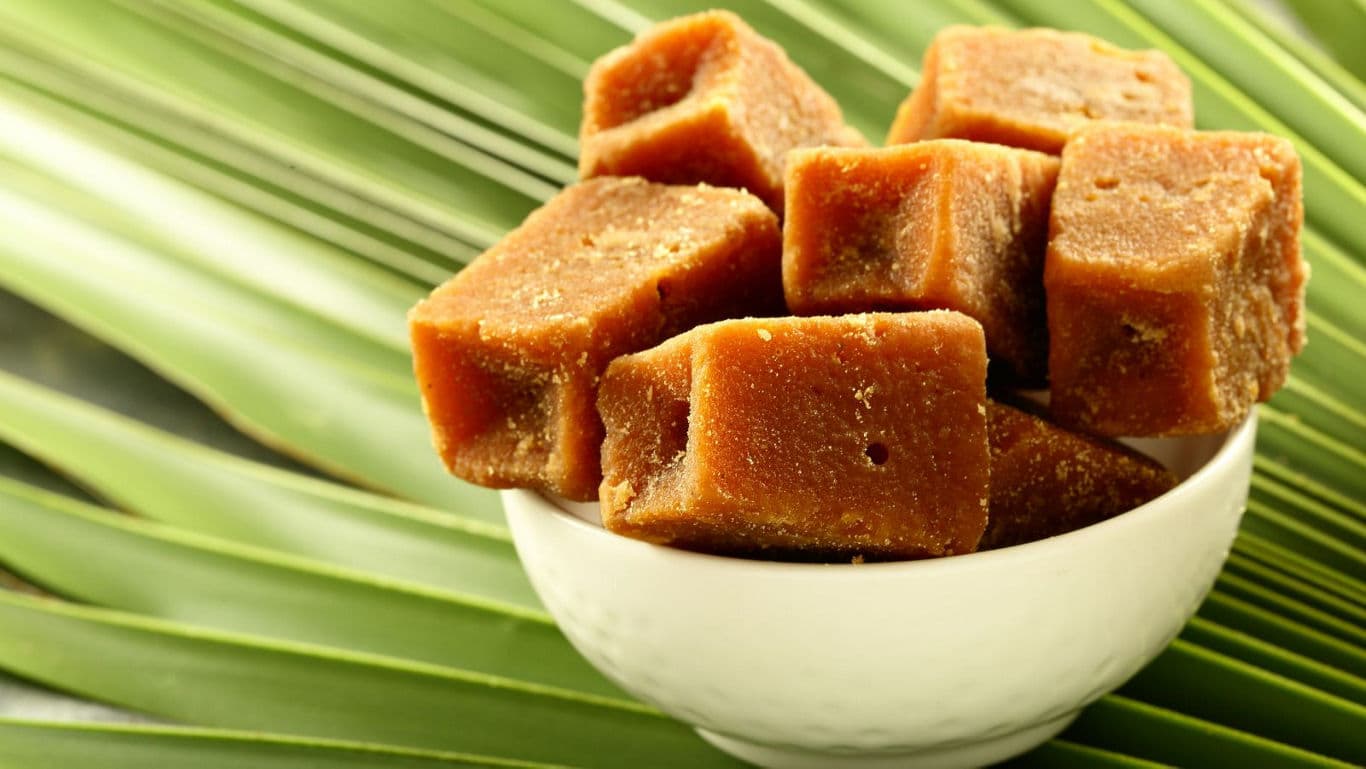 Cubes of jaggery in white bowl