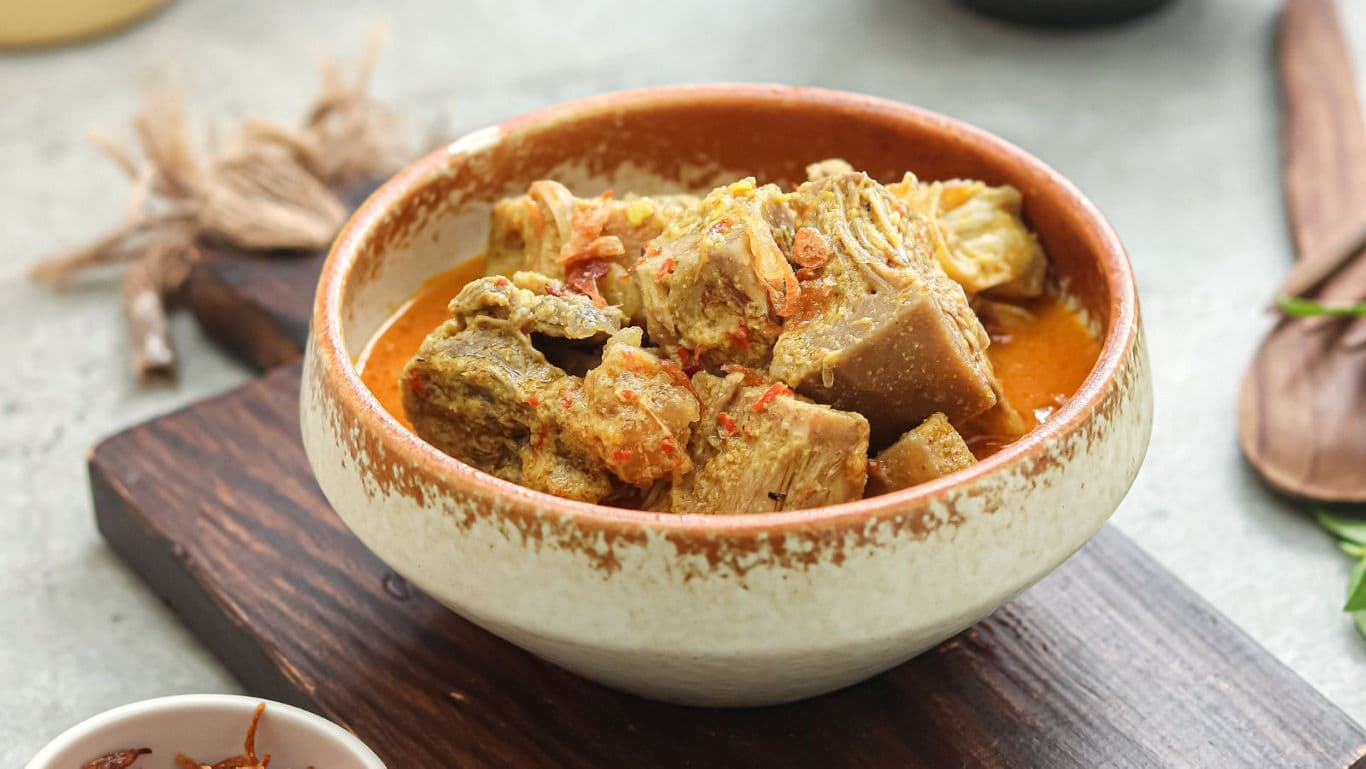 Spicy Meat Curry Served in Rustic Ceramic Bowl