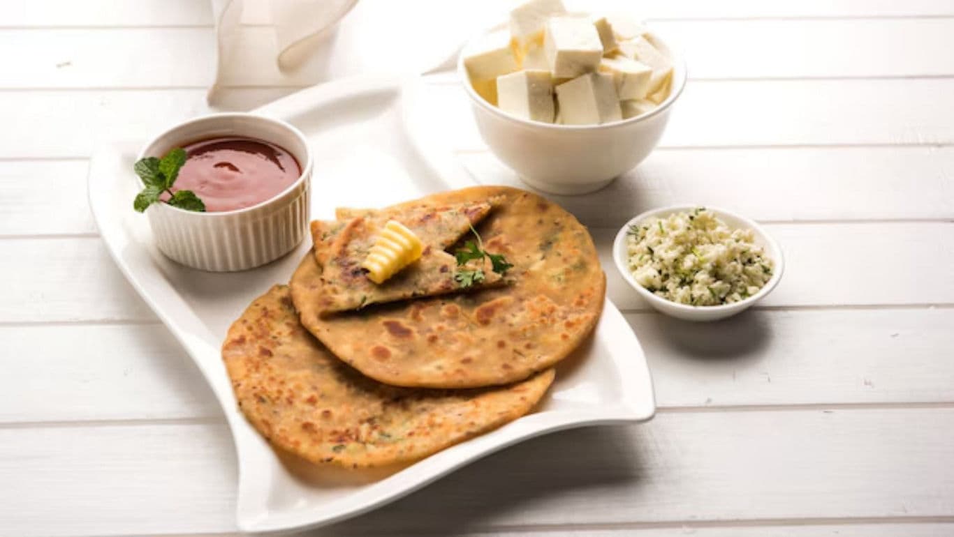 Stuffed parathas with butter and sides