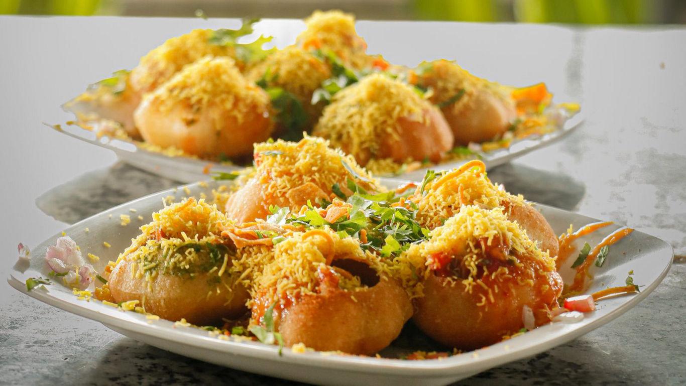 Indian street food dish with vibrant toppings