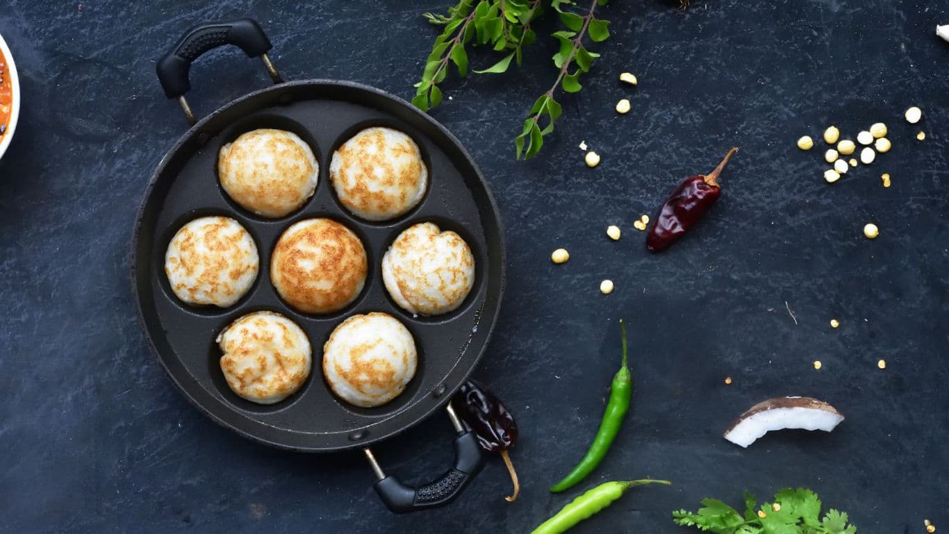 Appam pan with golden brown snacks