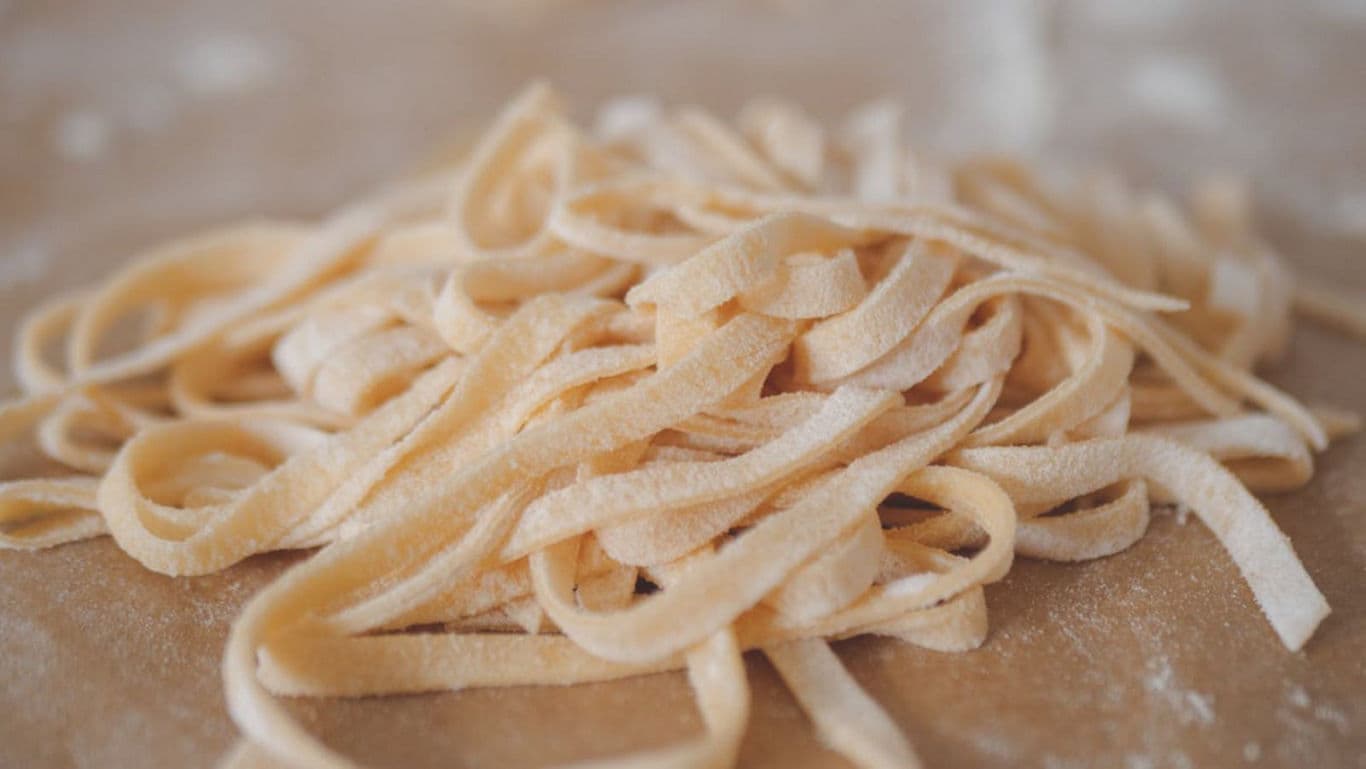 Freshly Cut Homemade Fettuccine Pasta on Table