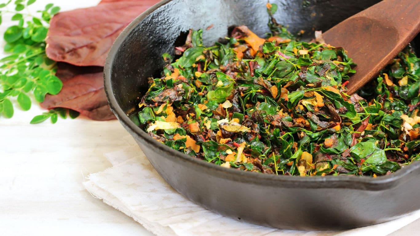 Sautéed leafy greens in cast iron skillet
