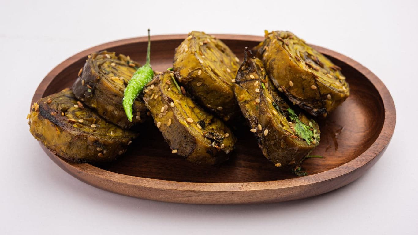 Traditional Indian Patra Rolls on Wooden Plate