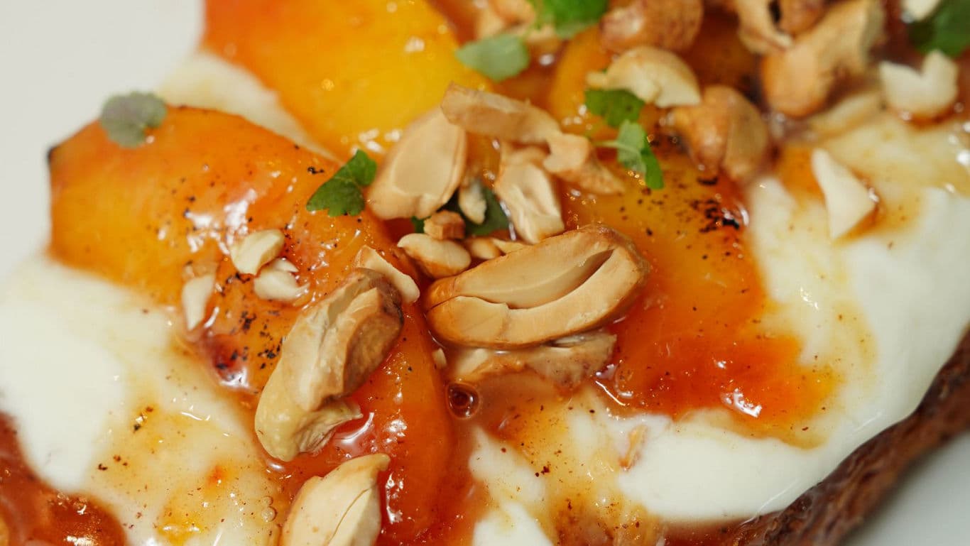 Toast with peaches yogurt and nuts