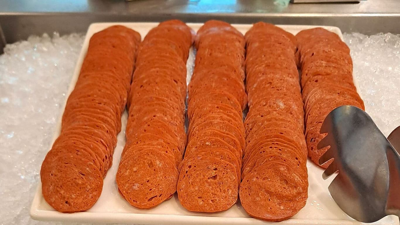 Rows of Sliced Sausage on Ice Display Tray