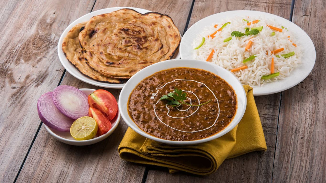 Indian meal with dal, rice, and bread