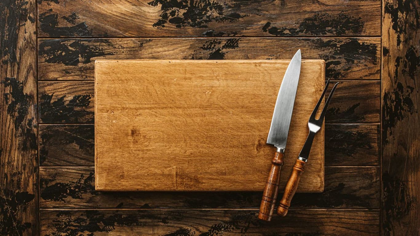 Wooden cutting board with knife and fork set