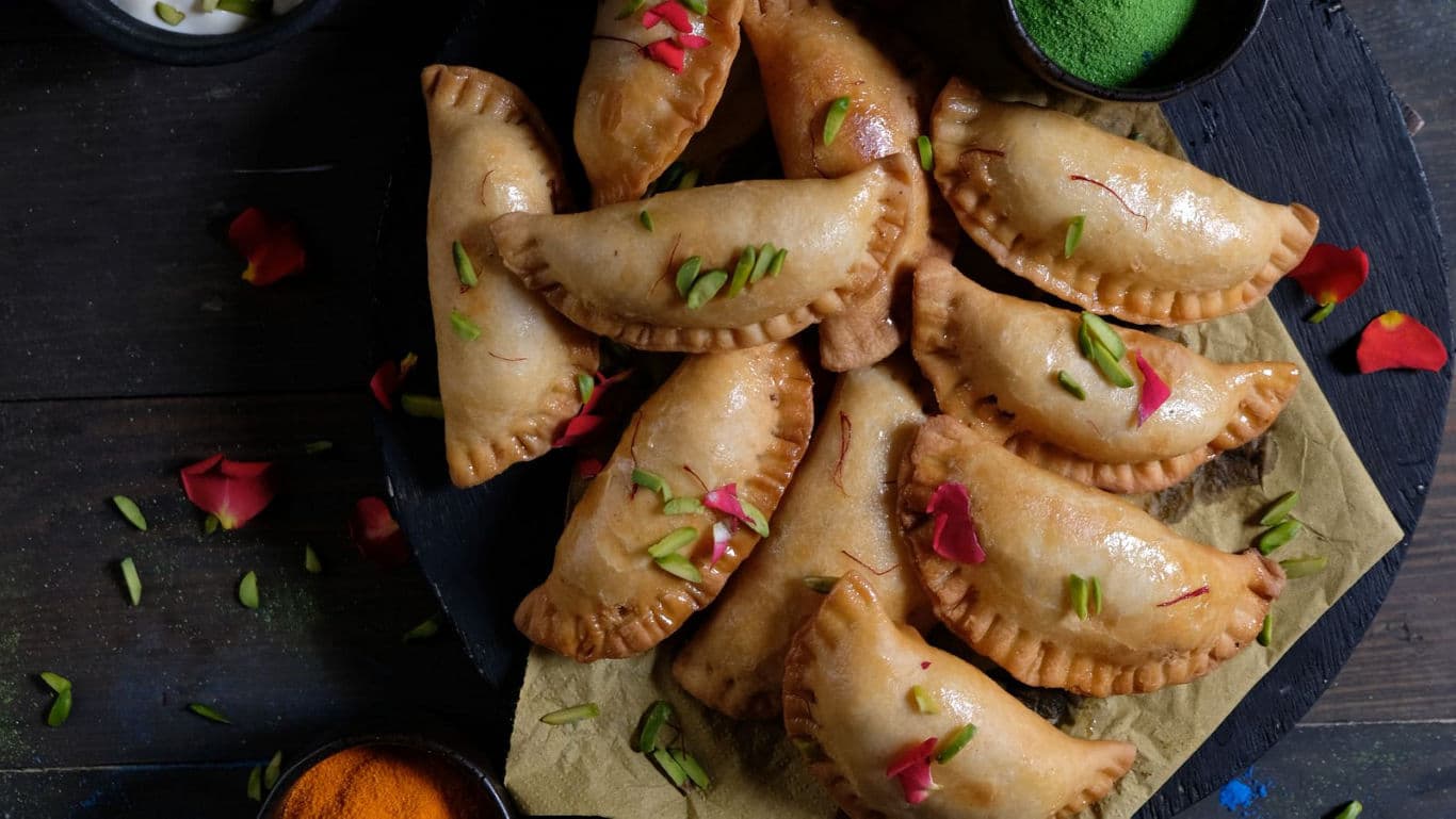 Traditional fried pastries on rustic serving board