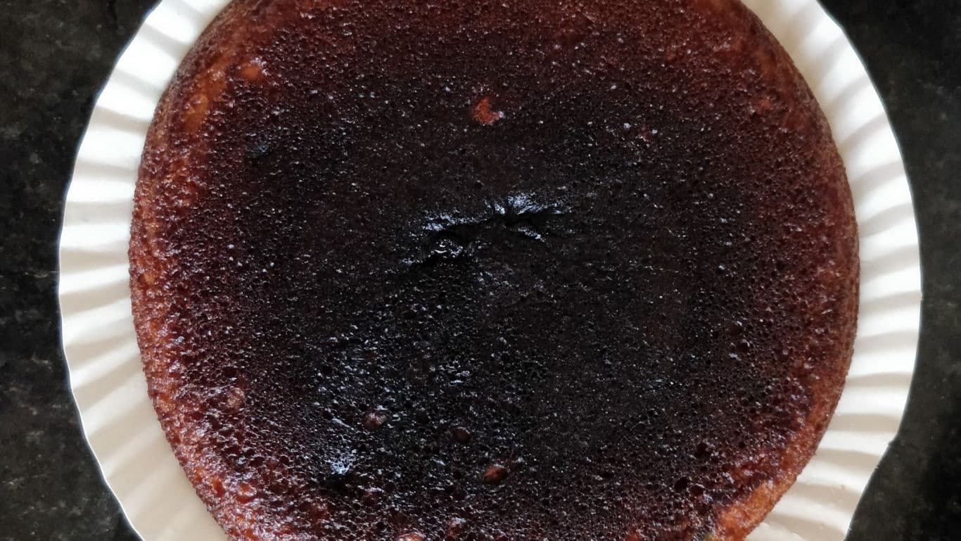 Homemade caramelized cake on white plate