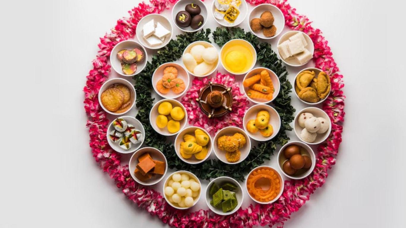 Assorted Indian sweets arranged in floral pattern