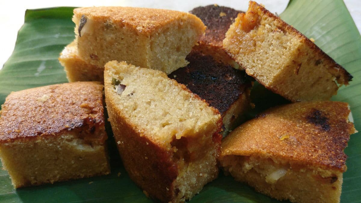 Pieces of poda pitha on banana leaf