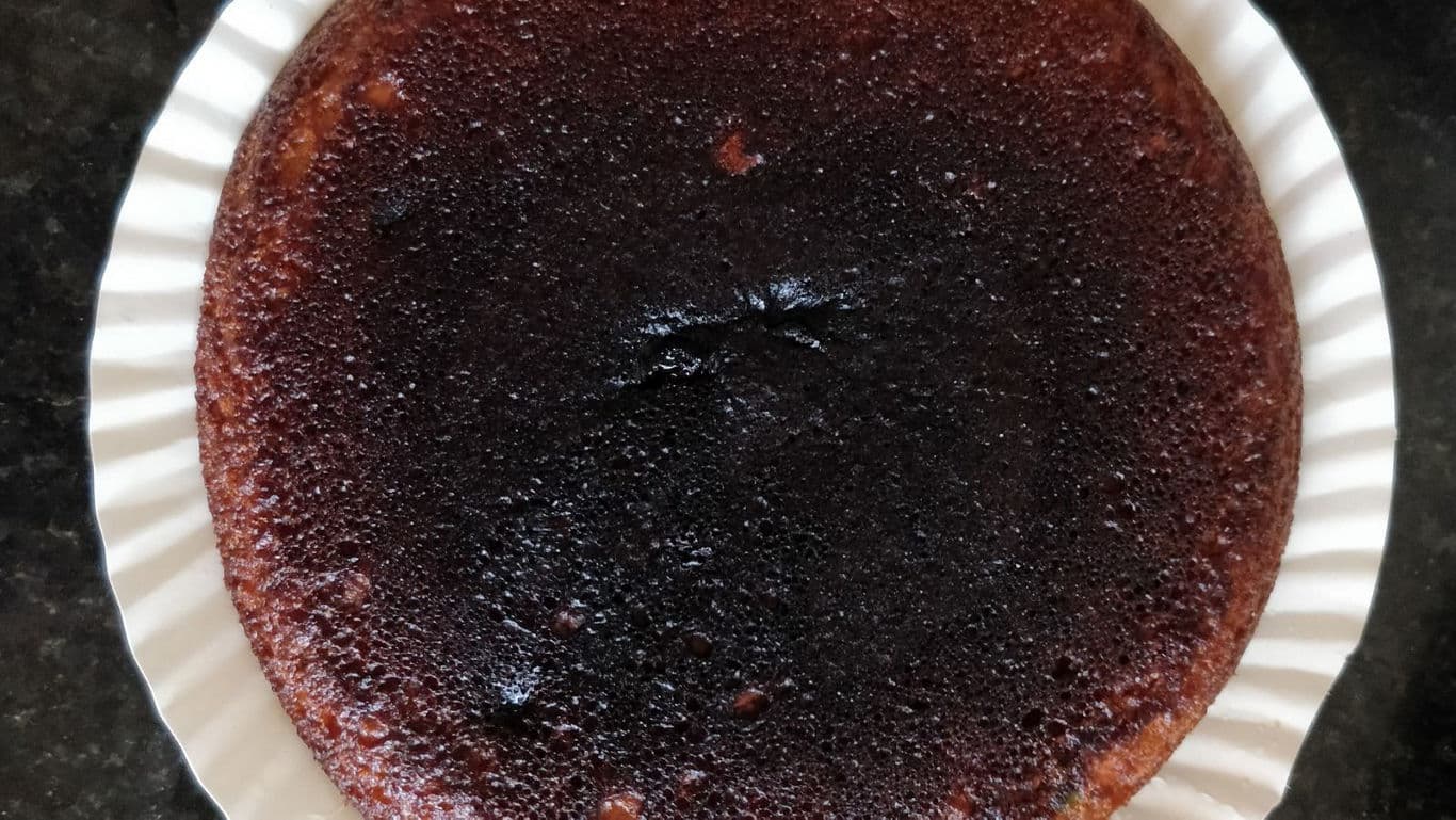 Homemade caramelized cake on white plate