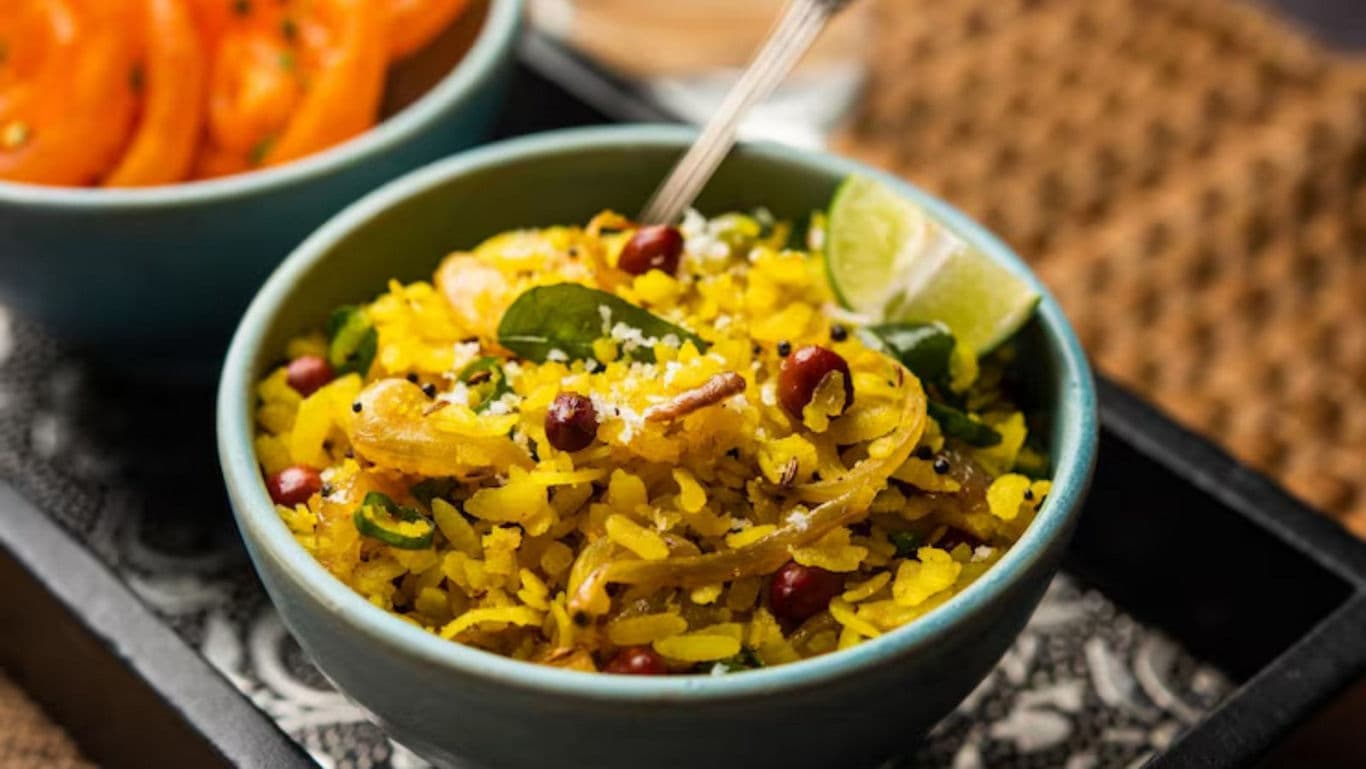 Traditional Indian Poha Served with Fresh Tomato Salad