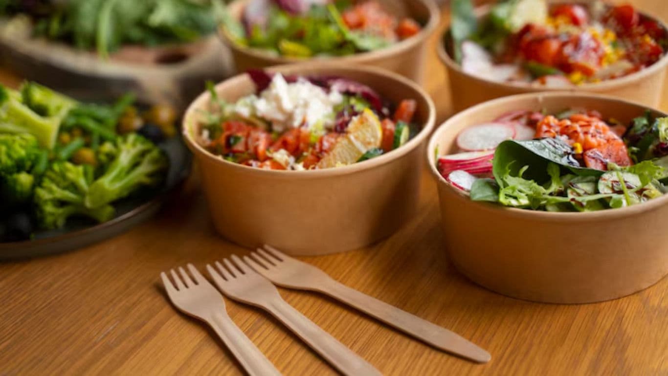 Assorted Fresh Salads in Brown Paper Bowls