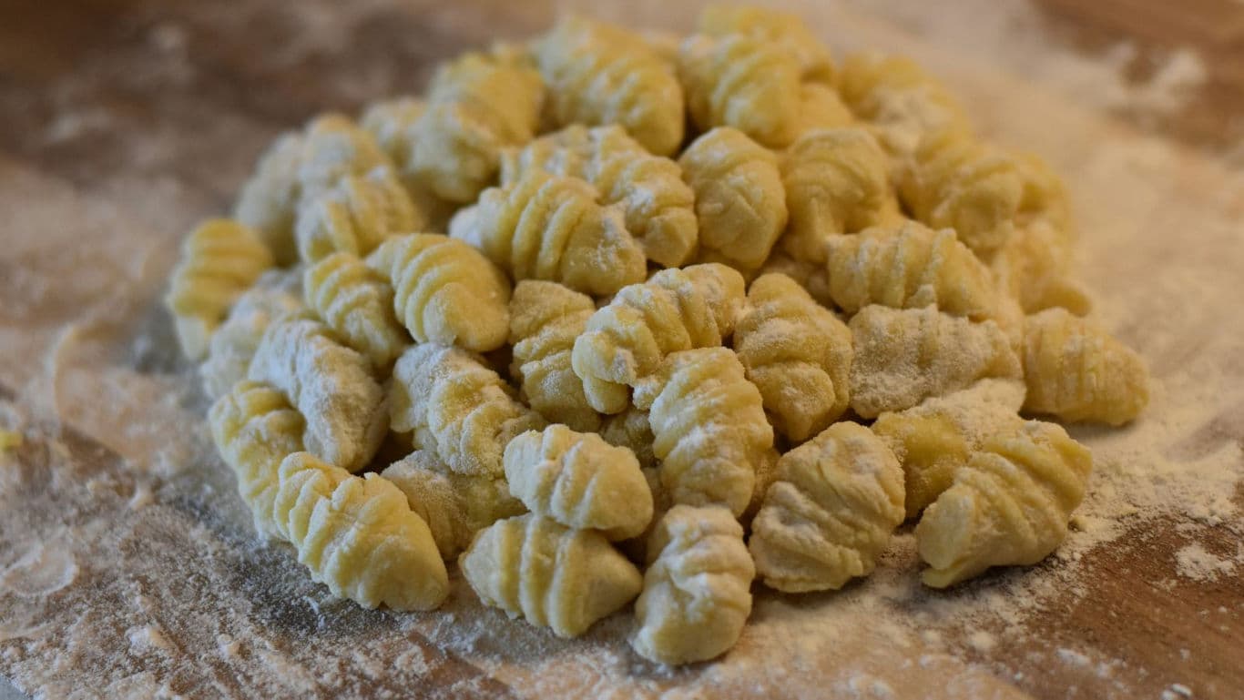 Fresh homemade gnocchi on floured surface
