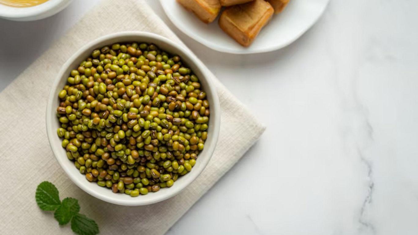 Bowl of green lentils with snacks