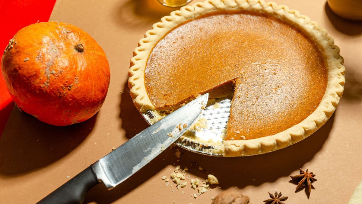 Pumpkin pie with pumpkin on the side