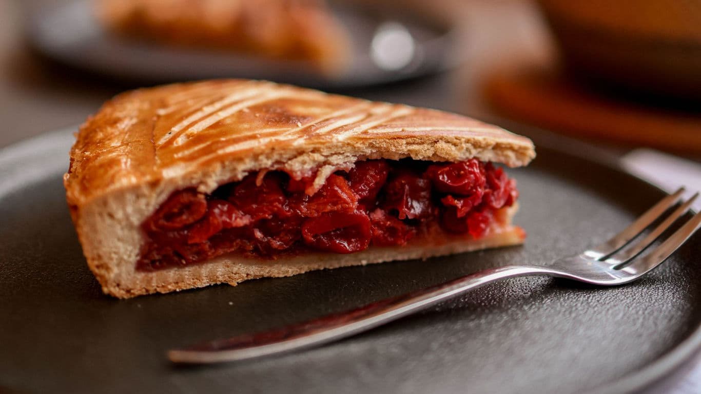 Slice of cherry pie on plate