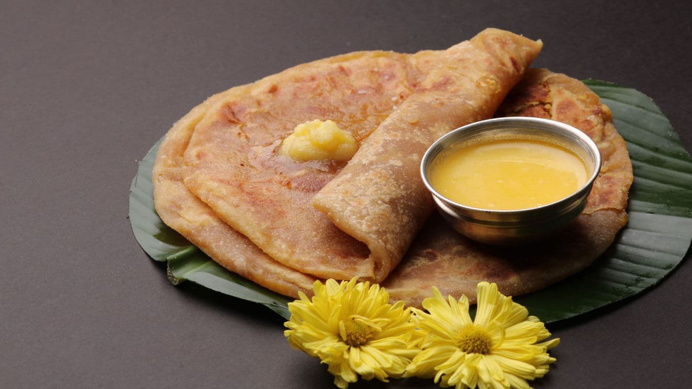 Traditional Indian Sweet Paratha with Ghee and Syrup