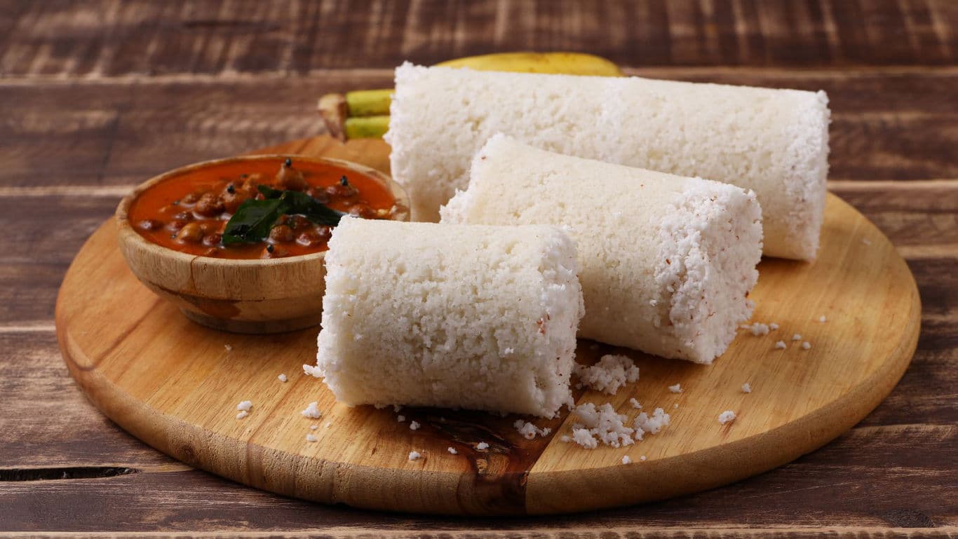 Traditional South Indian Puttu with Curry on Board