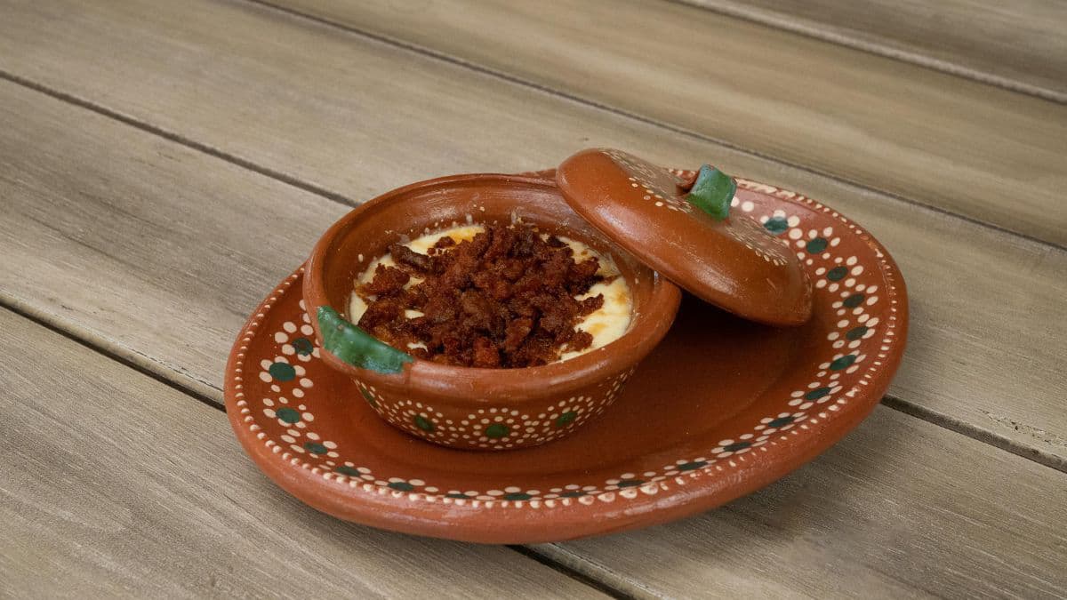 Queso Fundido in clay dish