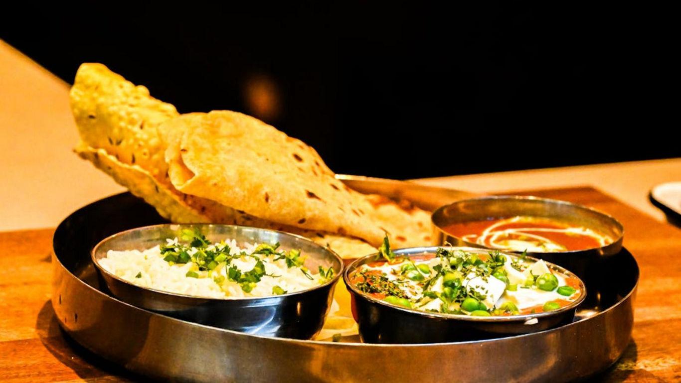 Traditional Indian Thali with Roti and Curries