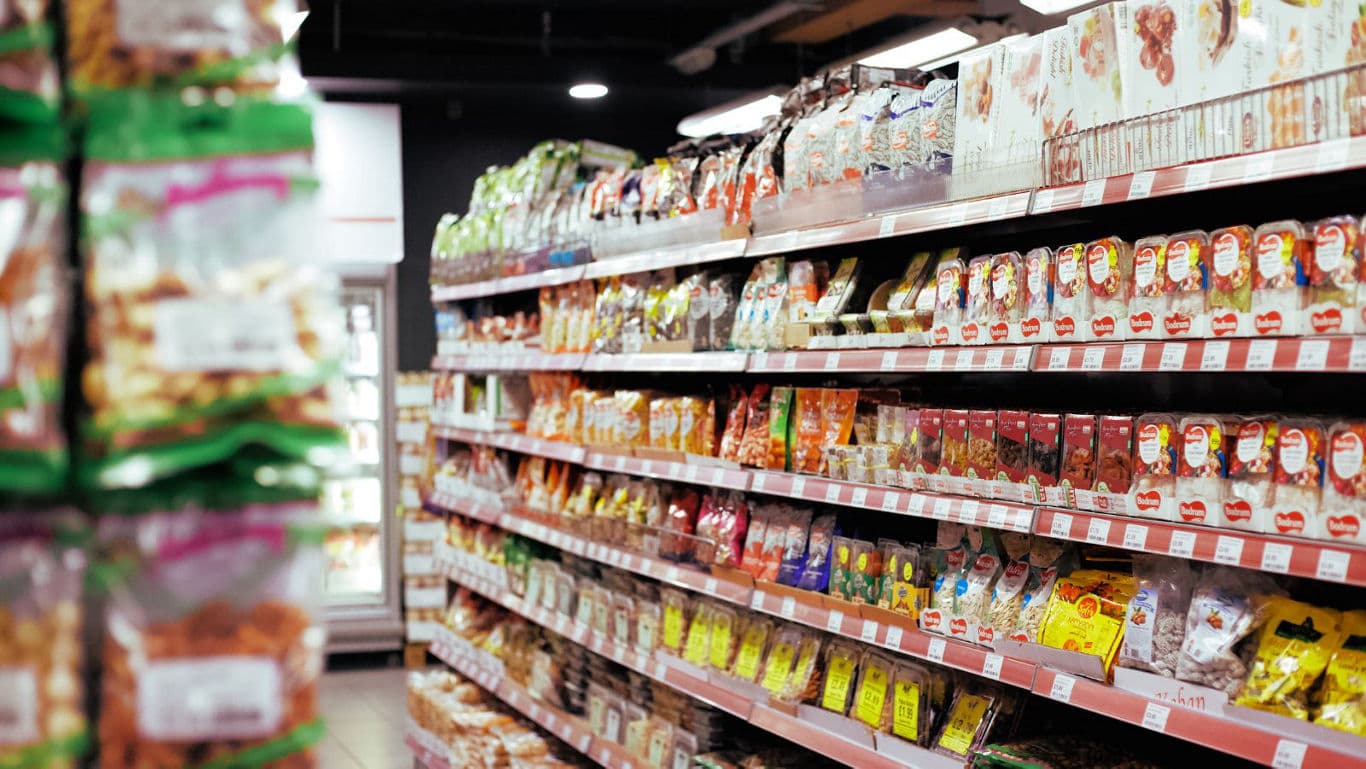 Grocery store aisle with packaged snacks