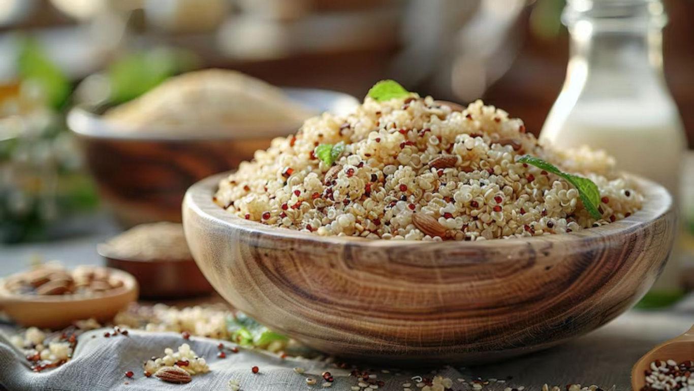 Wooden bowl of cooked quinoa with garnish