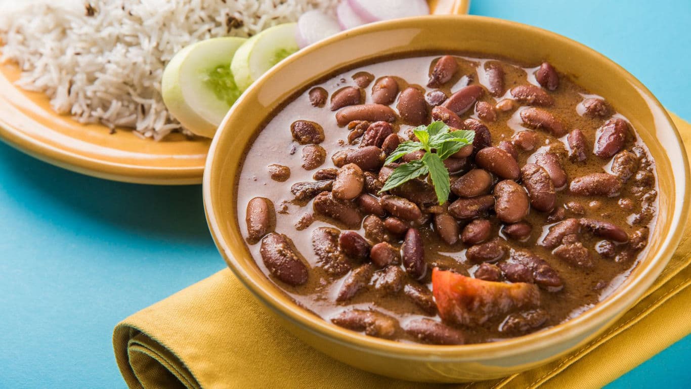 Indian kidney bean curry served with rice and salad