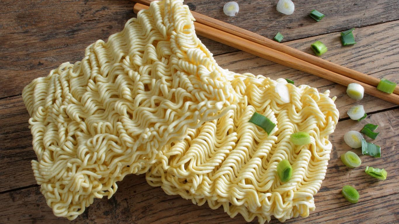 Uncooked instant ramen noodles with green onions