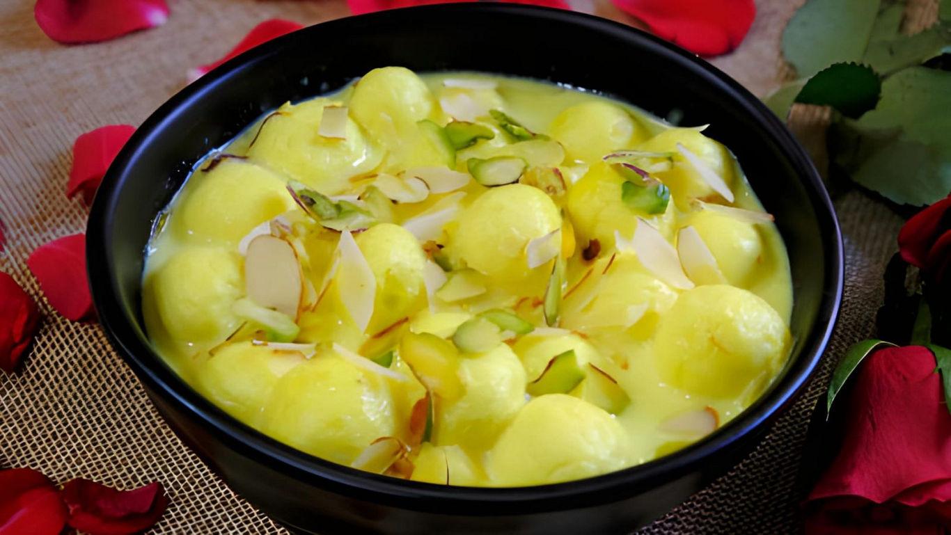 Bowl of Rasmalai with Almond Garnish
