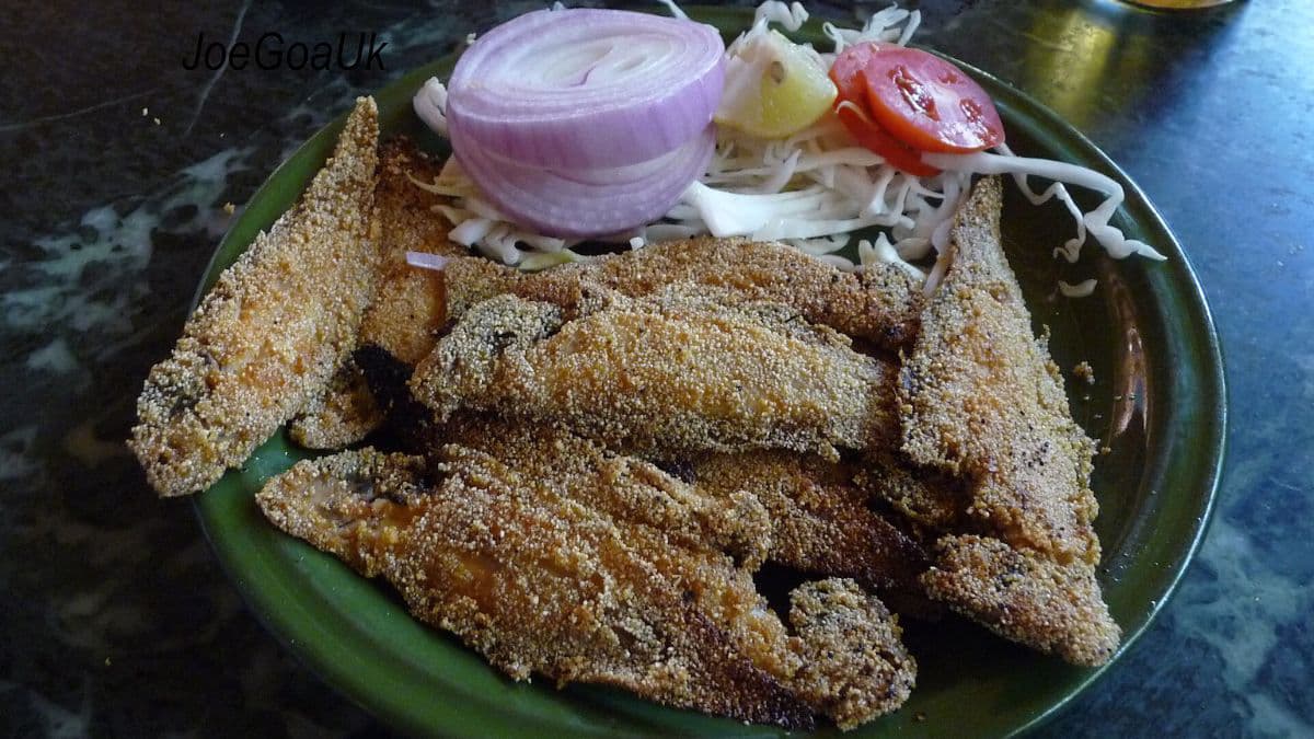 Rava fish fry with sliced onions