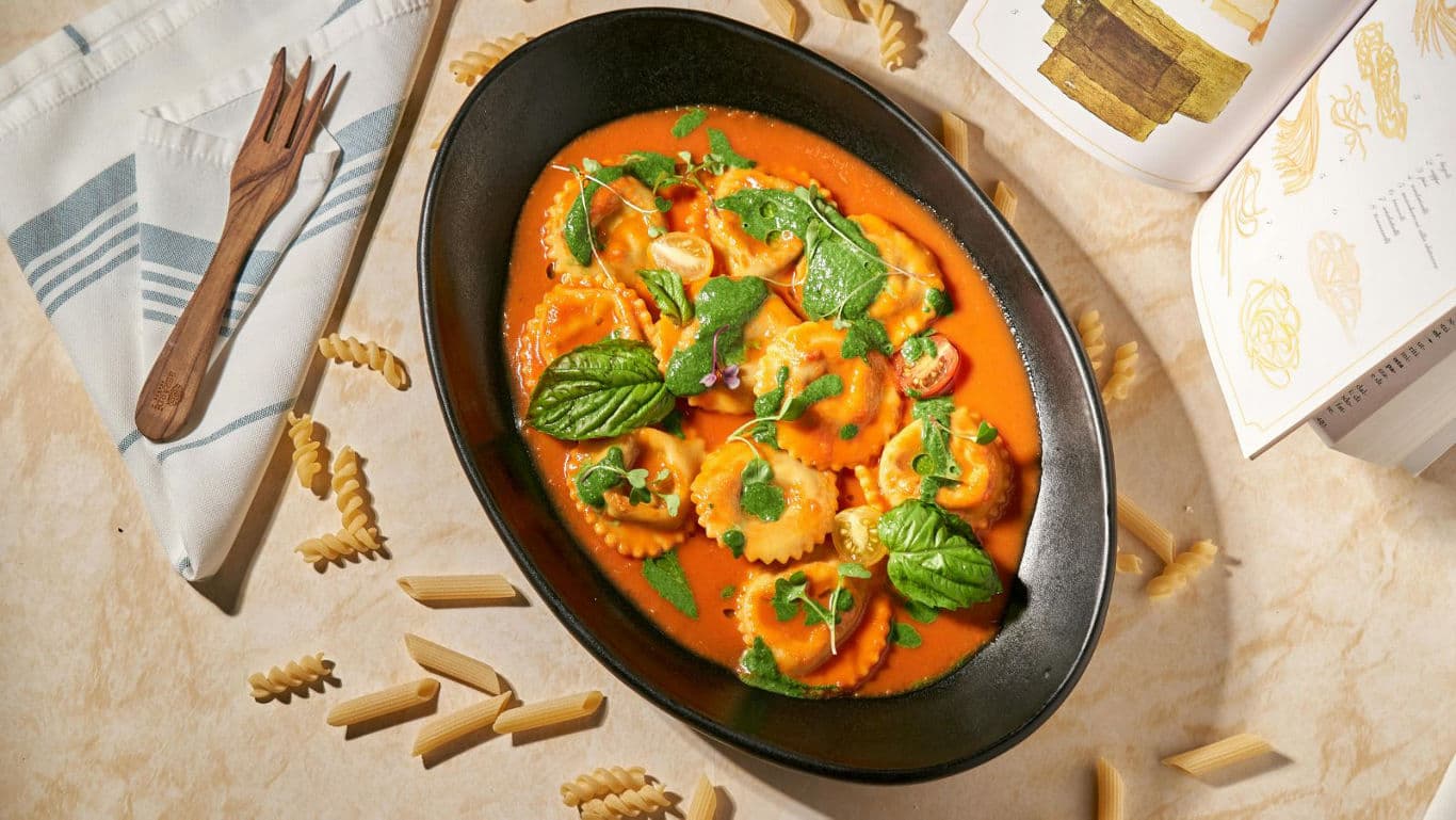 Ravioli in Tomato Sauce with Fresh Basil Garnish