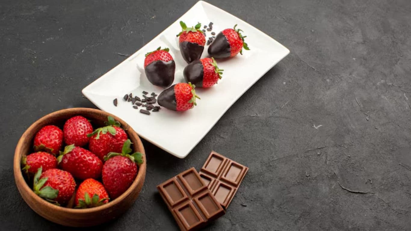 Chocolate dipped strawberries with fresh fruit and bars