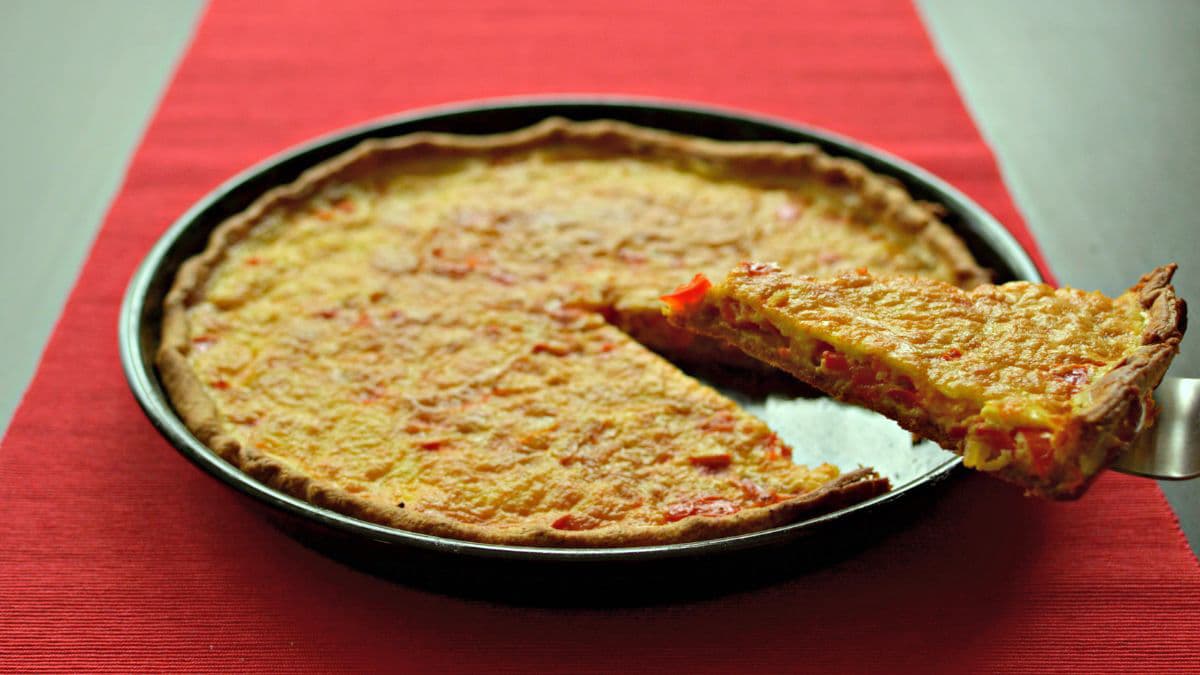 Quiche slice being cut