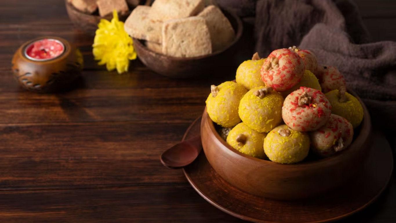 Traditional Indian sweets on wooden table