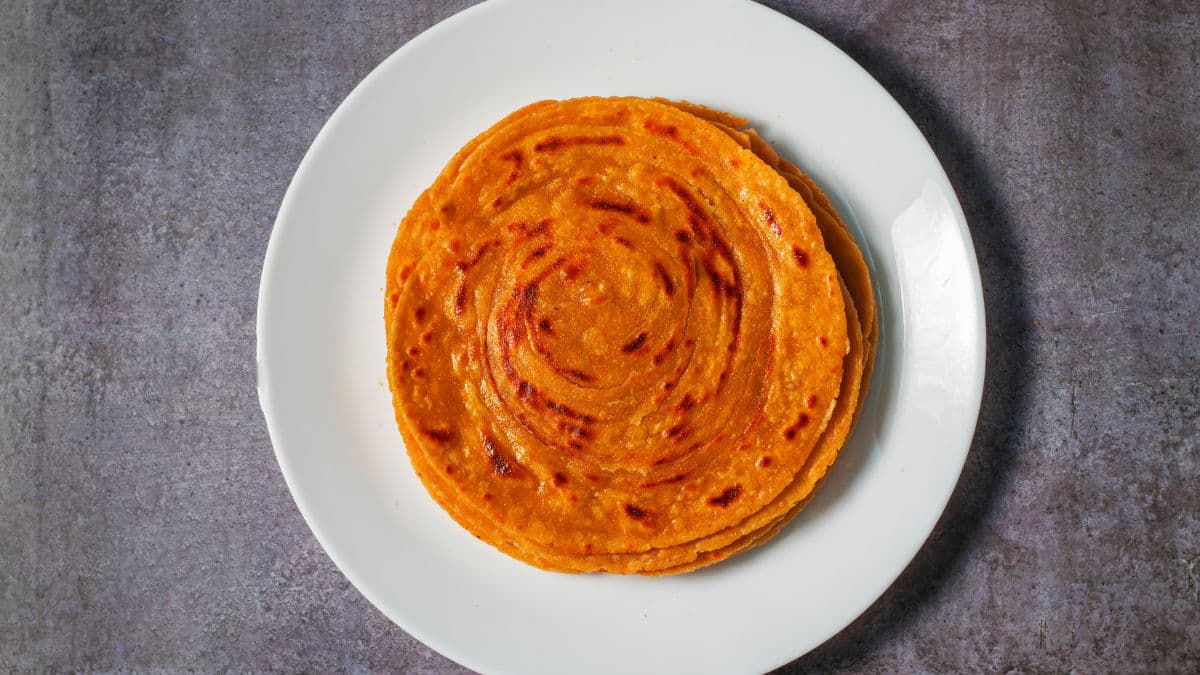 khapli atta laccha parathas on a plate