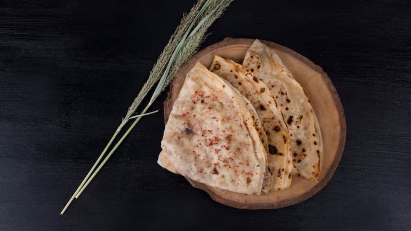 Flatbread on Wooden Plate with Grains