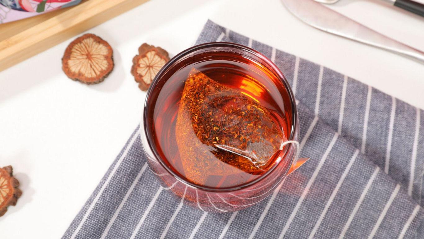 Glass of herbal tea with dried slices