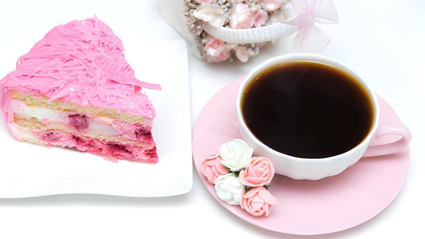 Slice of Pink Cake with Black Coffee Cup