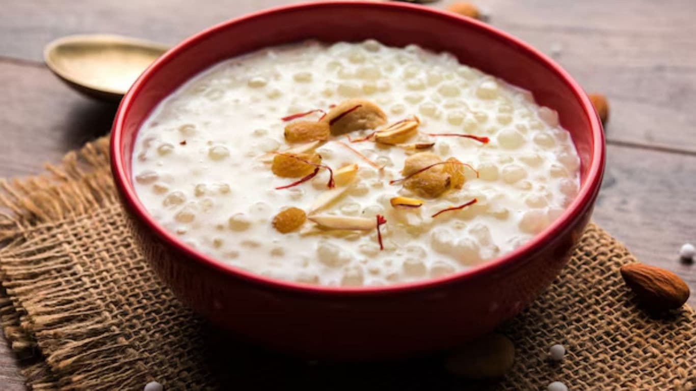 Creamy Tapioca Pudding with Almond Garnish in Red Bowl