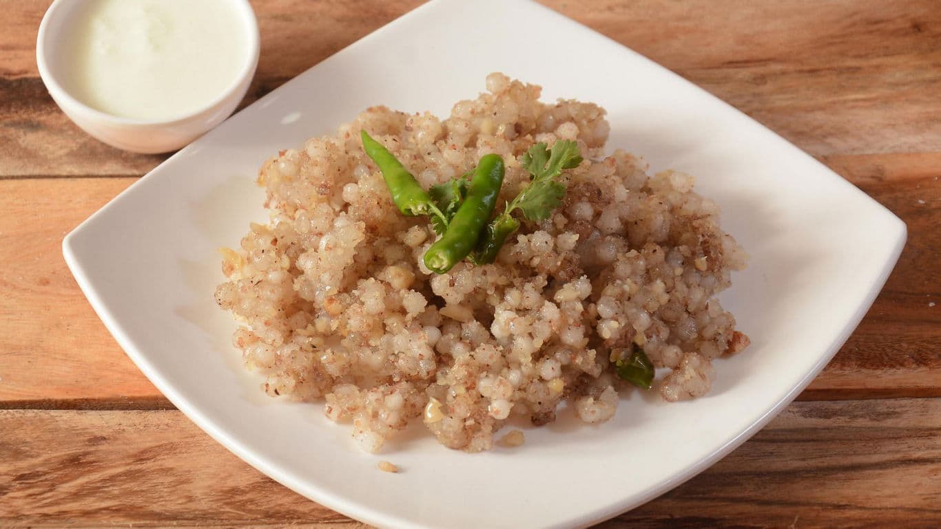 Sabudana khichdi served with green chili garnish